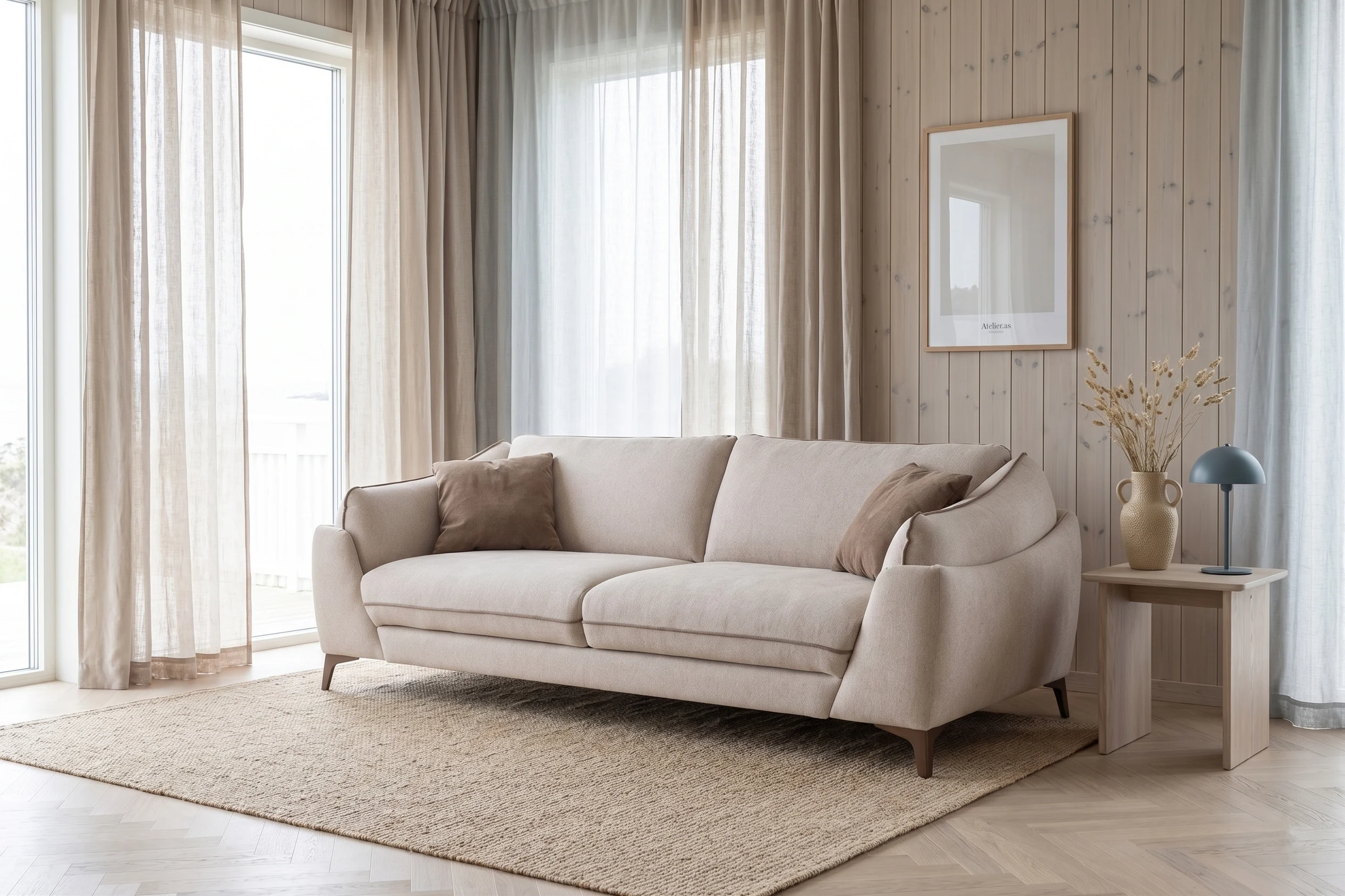 Lys beige Dienne Dune sovesofa i en lys og luftig stue med gjennomført skandinavisk design.