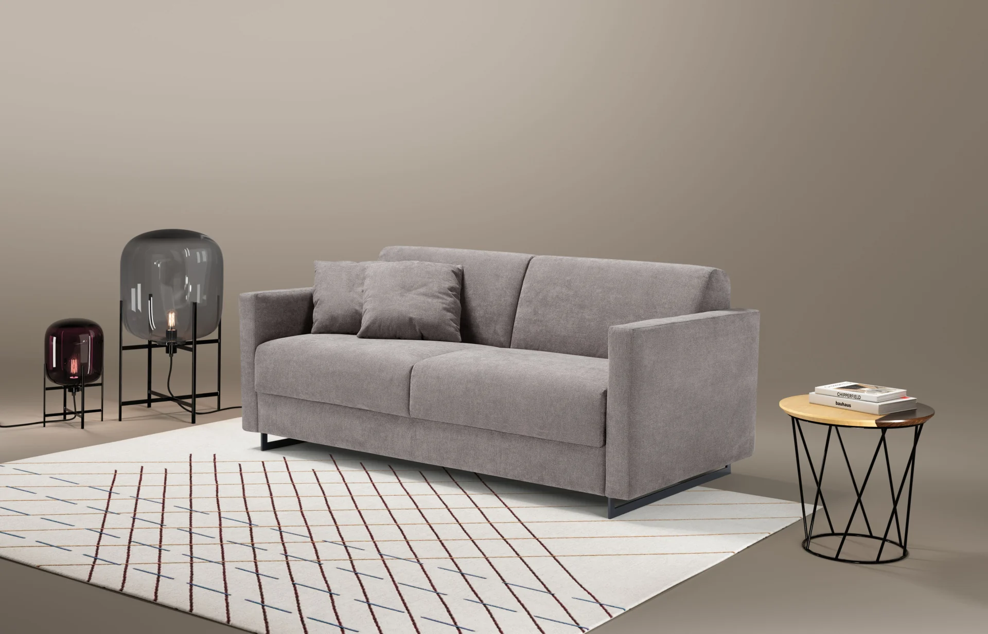 Komfortabel grå sovesofa fra Dienne med avtagbare trekk, vist i et moderne stueinteriør.